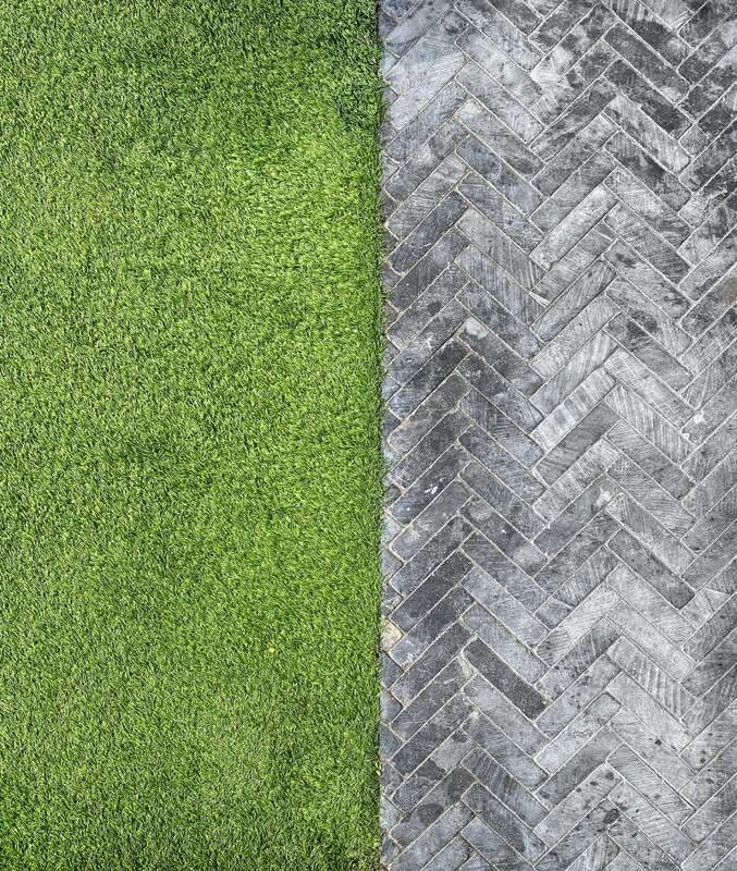 artificial grass vs concrete installation